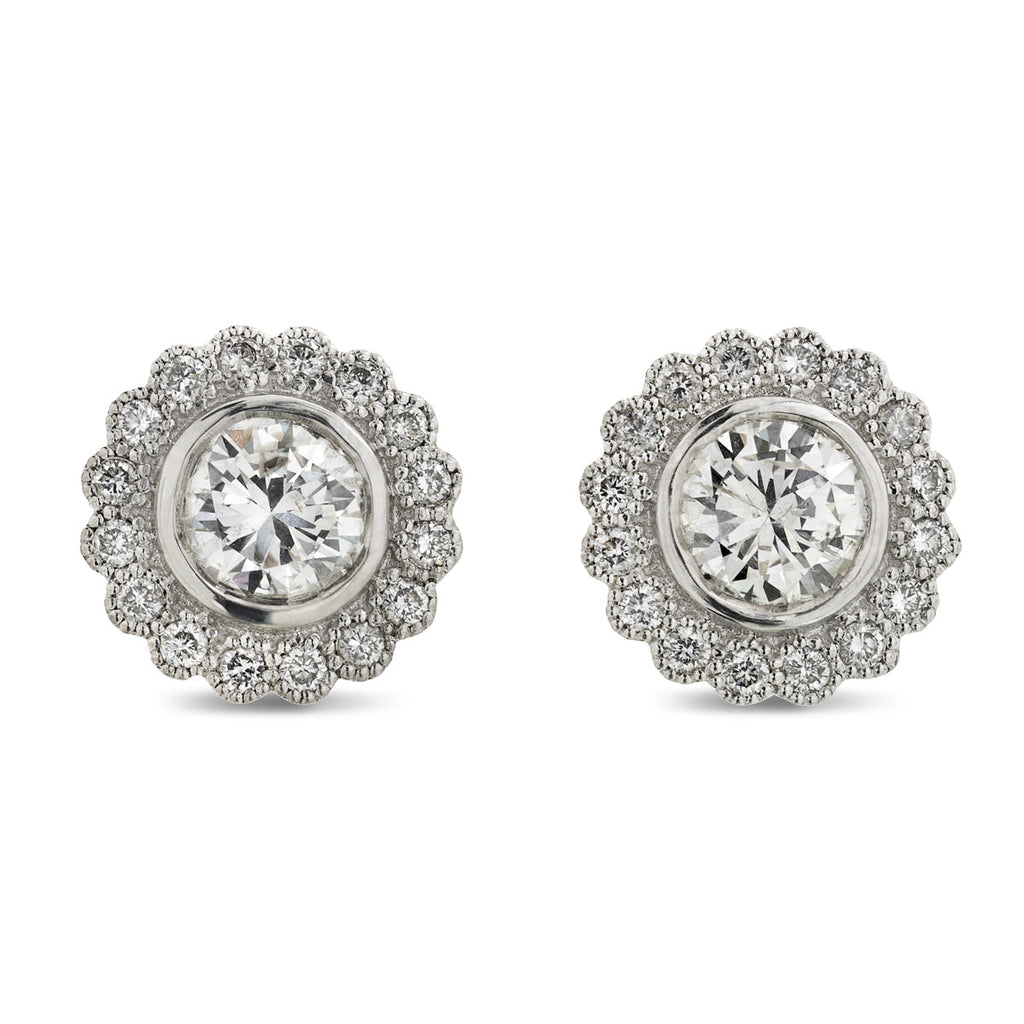 A pair of diamond halo Stud Earrings 1.80ct G-H SI1 WGI 18K white gold