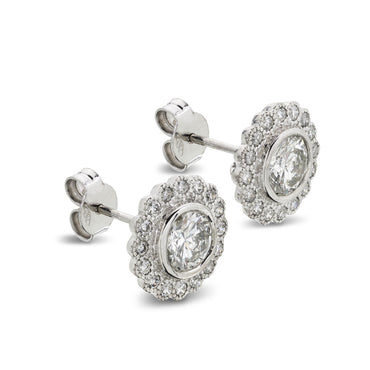 A pair of diamond halo Stud Earrings 1.80ct G-H SI1 WGI 18K white gold